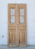 Pair of Carved Natural Wood Antique Doors with Iron Inserts
