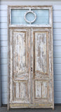 Pair of Framed 3 Panel Distressed Antique Doors with Circle Transom