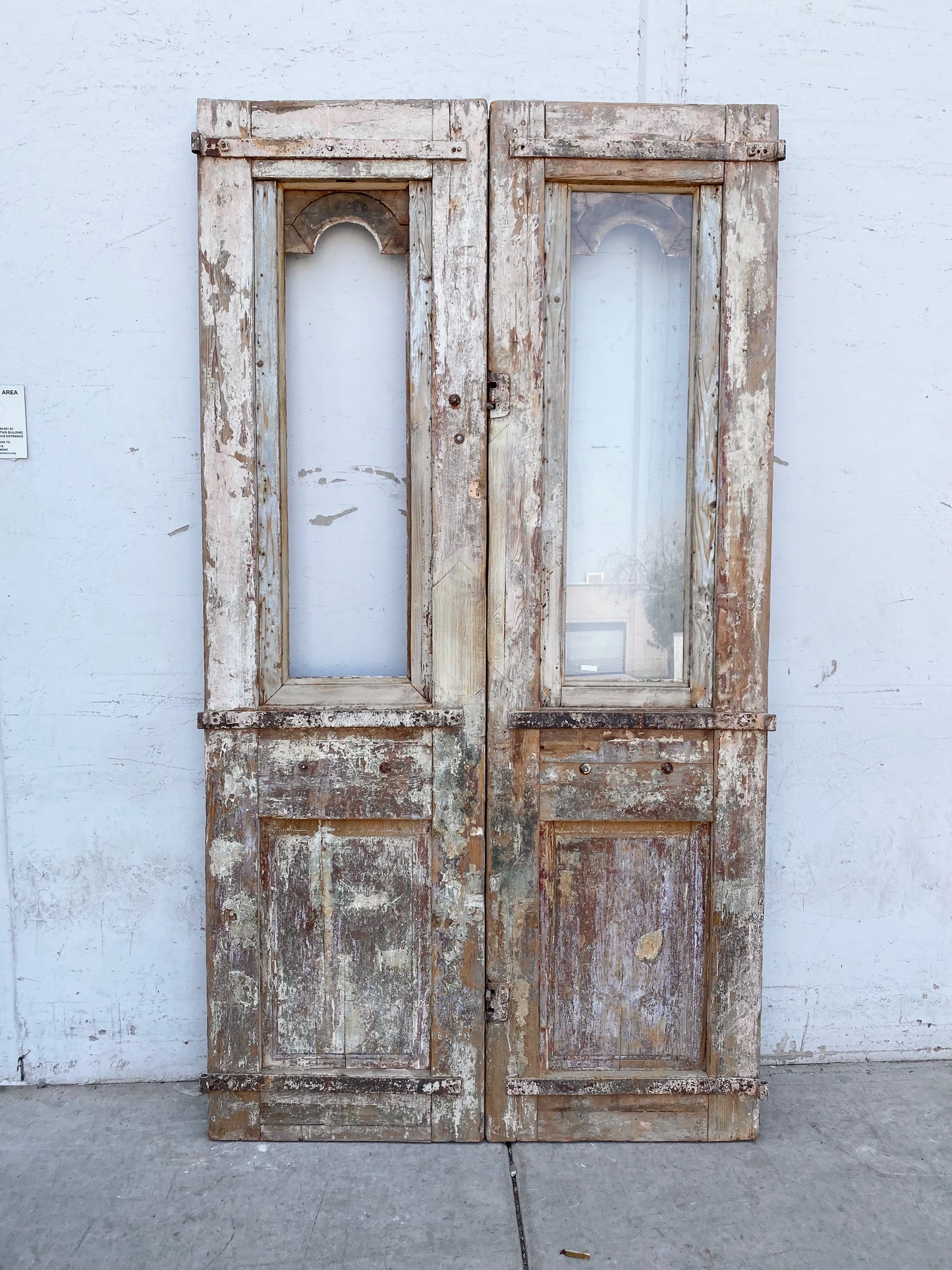 Pair of 2-Lite Antique Wood Carved Doors with Iron Inserts