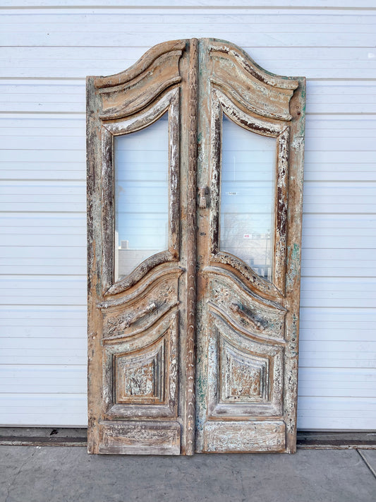 Pair of Antique Arched and Single Lite Carved Doors