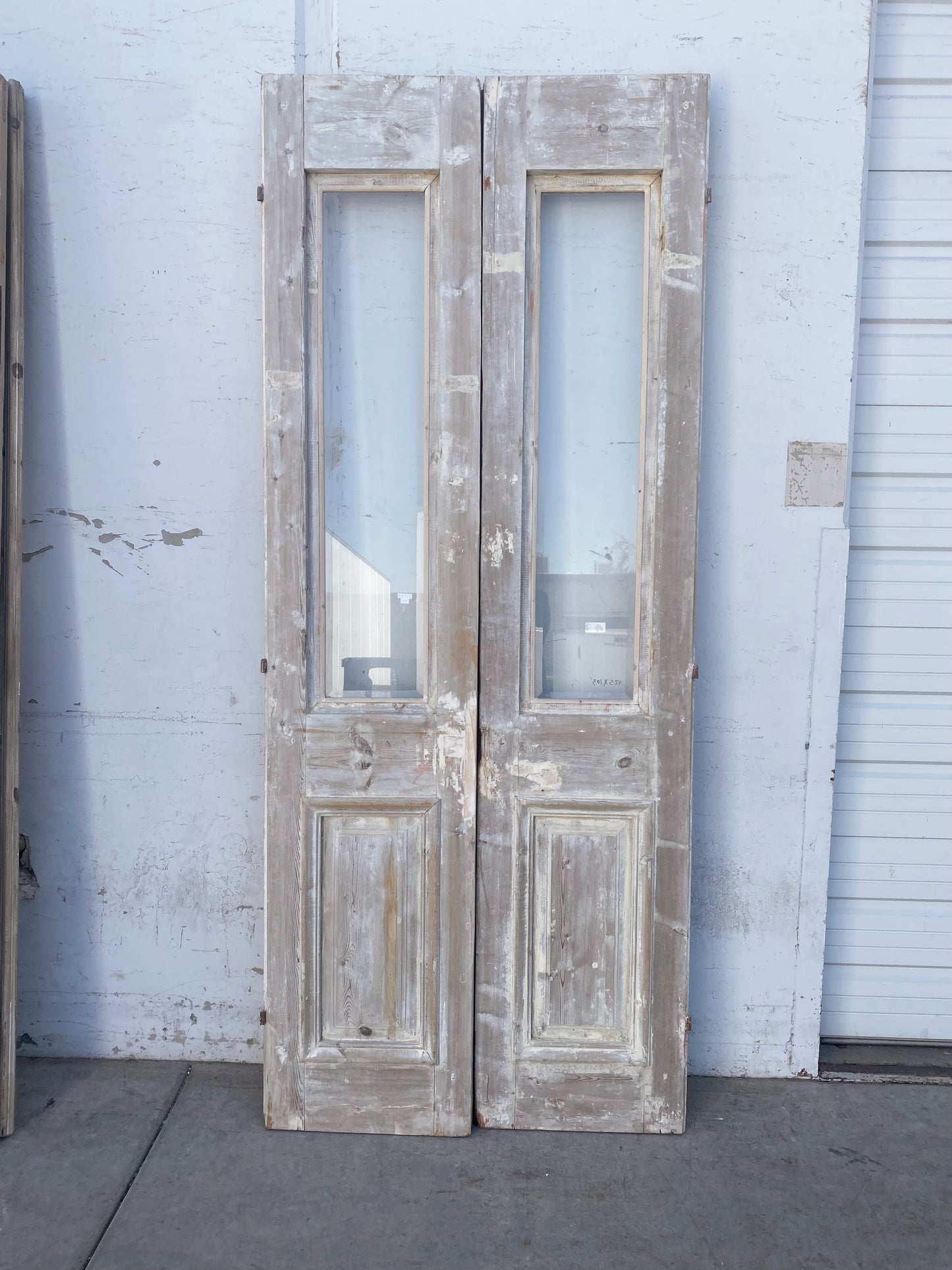 Pair of Antique Carved Doors with Single Glass Lite