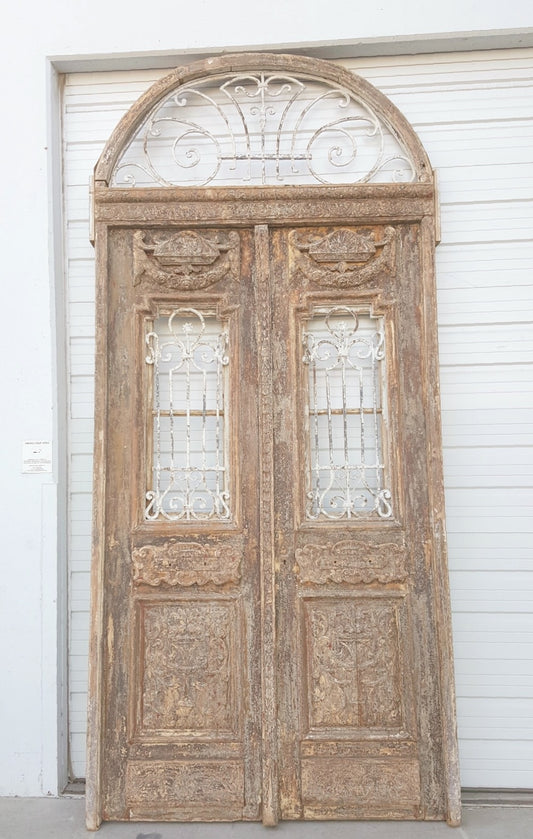 Pair of 3 Panel Carved Antique Doors with Iron Inserts